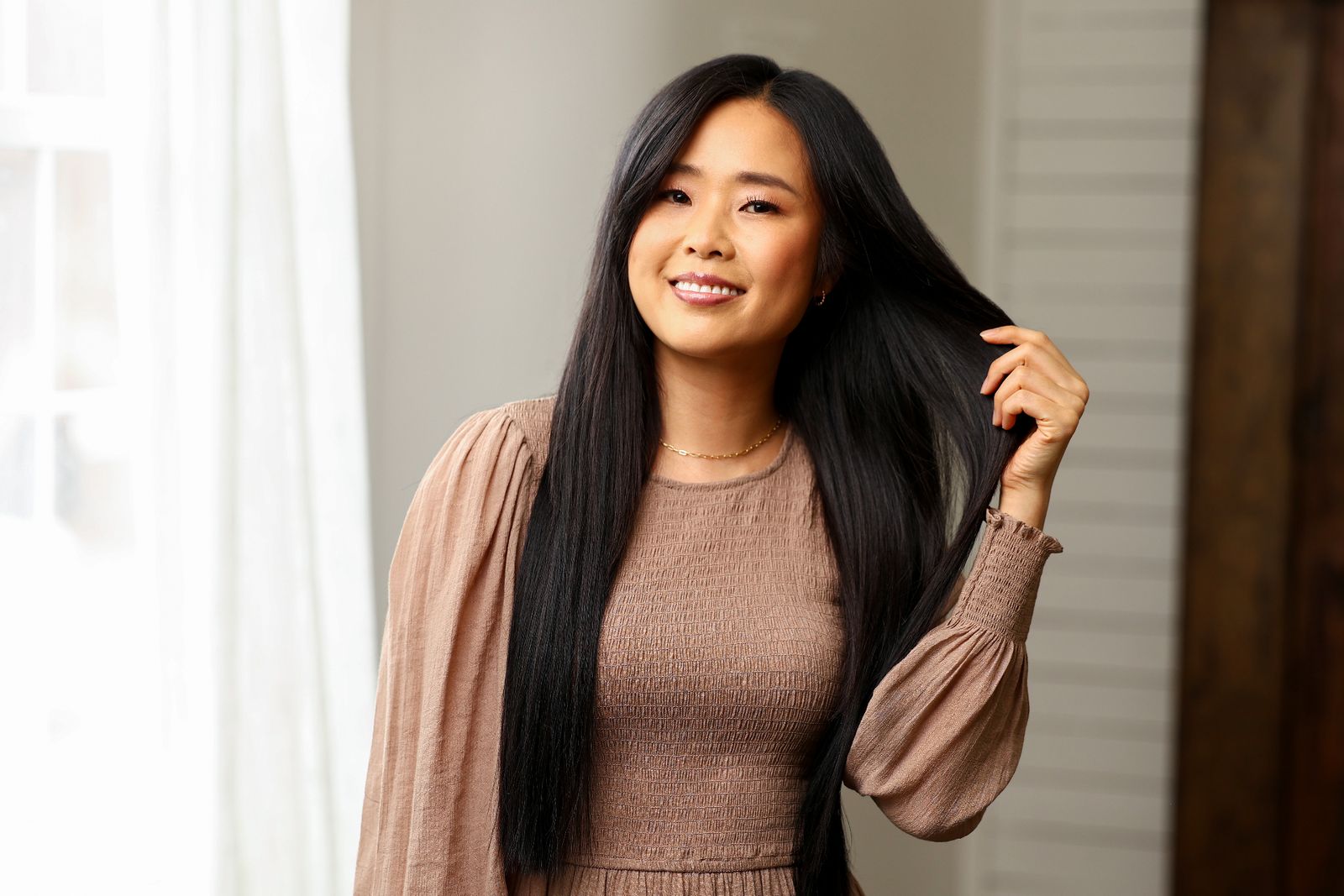 Client receiving hair extension service at Loxxie salon