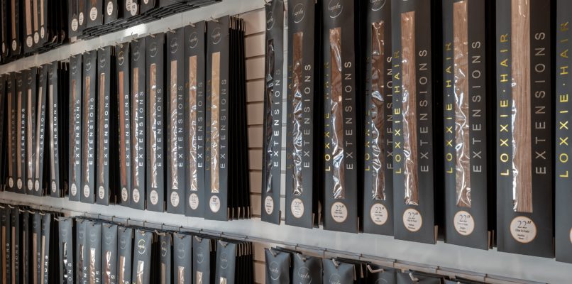 A large display of books neatly arranged on shelves, showcasing a variety of titles and genres.